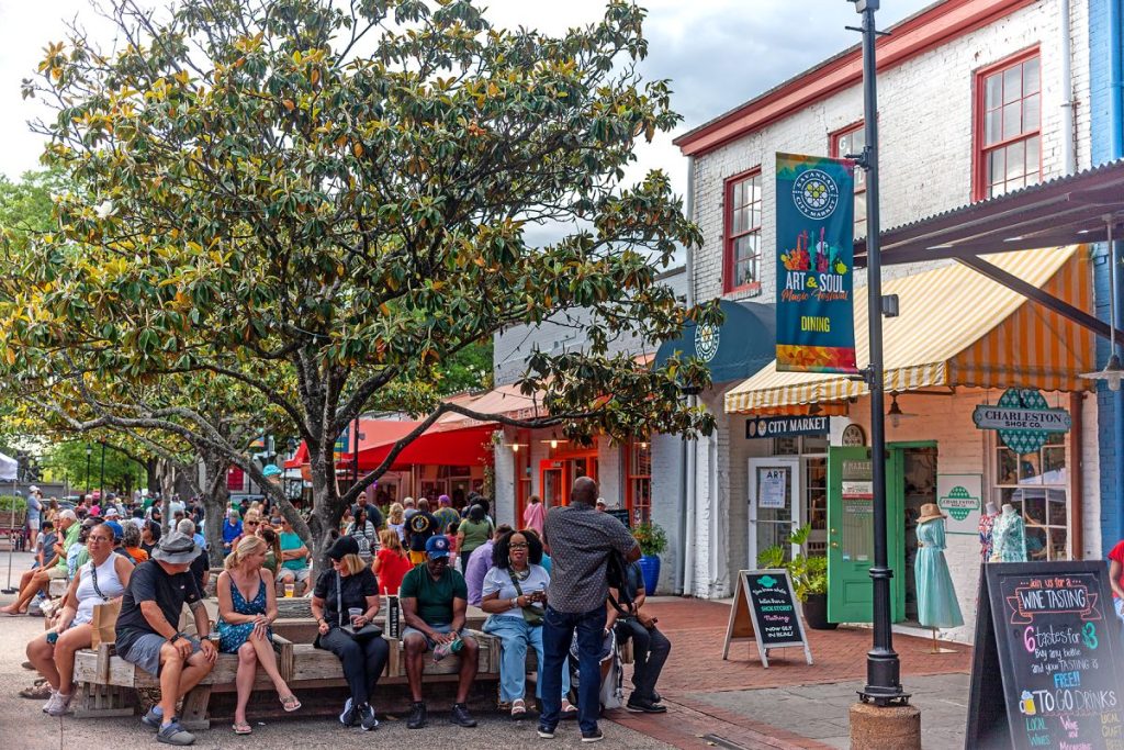 People sitting in Savannah City Market courtyard