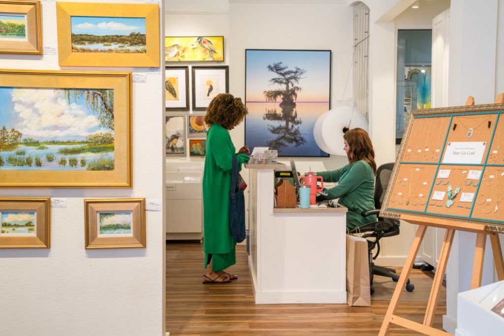 Woman making a purchase at Savannah City Market art gallery