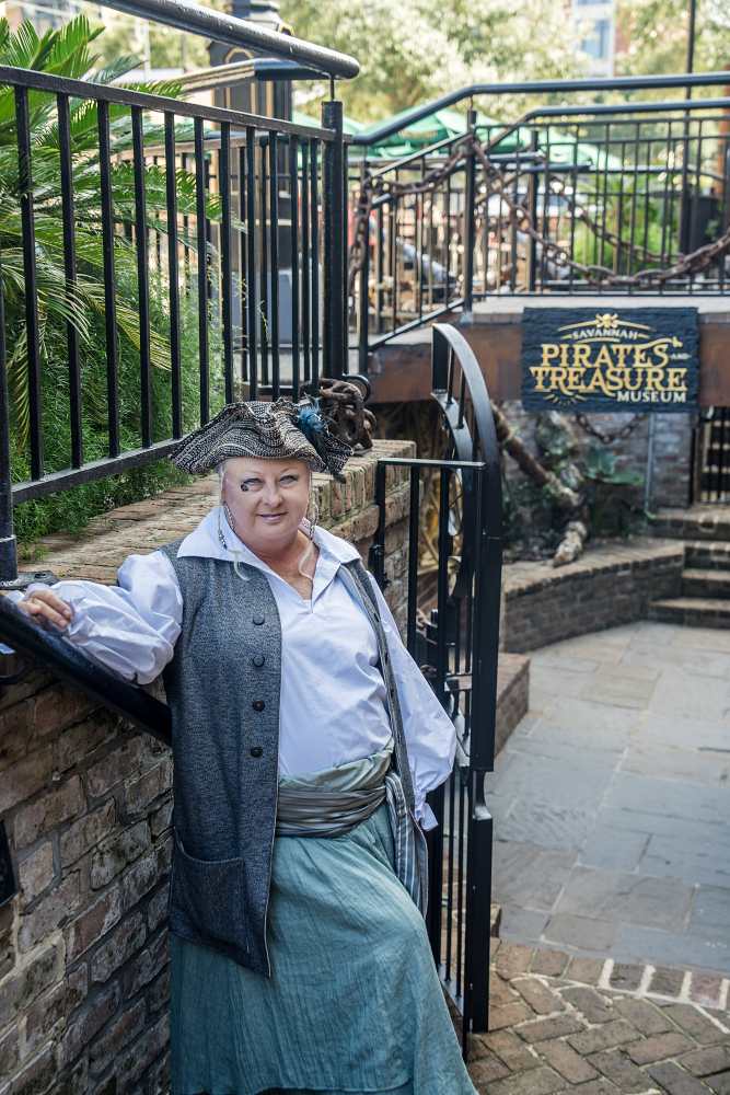 Woman dressed as a pirate outside Savannah Pirates & Treasure Museum